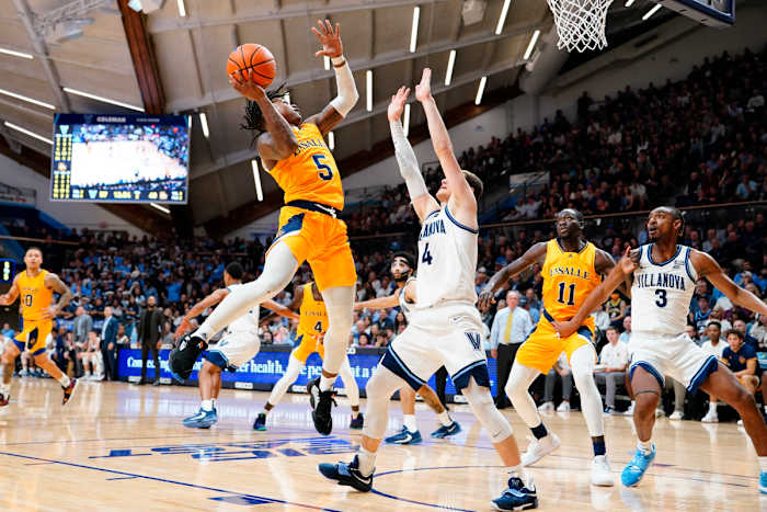 Nov 7, 2022; Villanova, Pennsylvania, USA; La Salle Explorers guard Khalil Brantley (5) shoots a layup against Villanova Wildcats guard Chris Arcidiacono (4) during the second half at William B. Finneran Pavilion. Mandatory Credit: Gregory Fisher-USA TODAY Sports